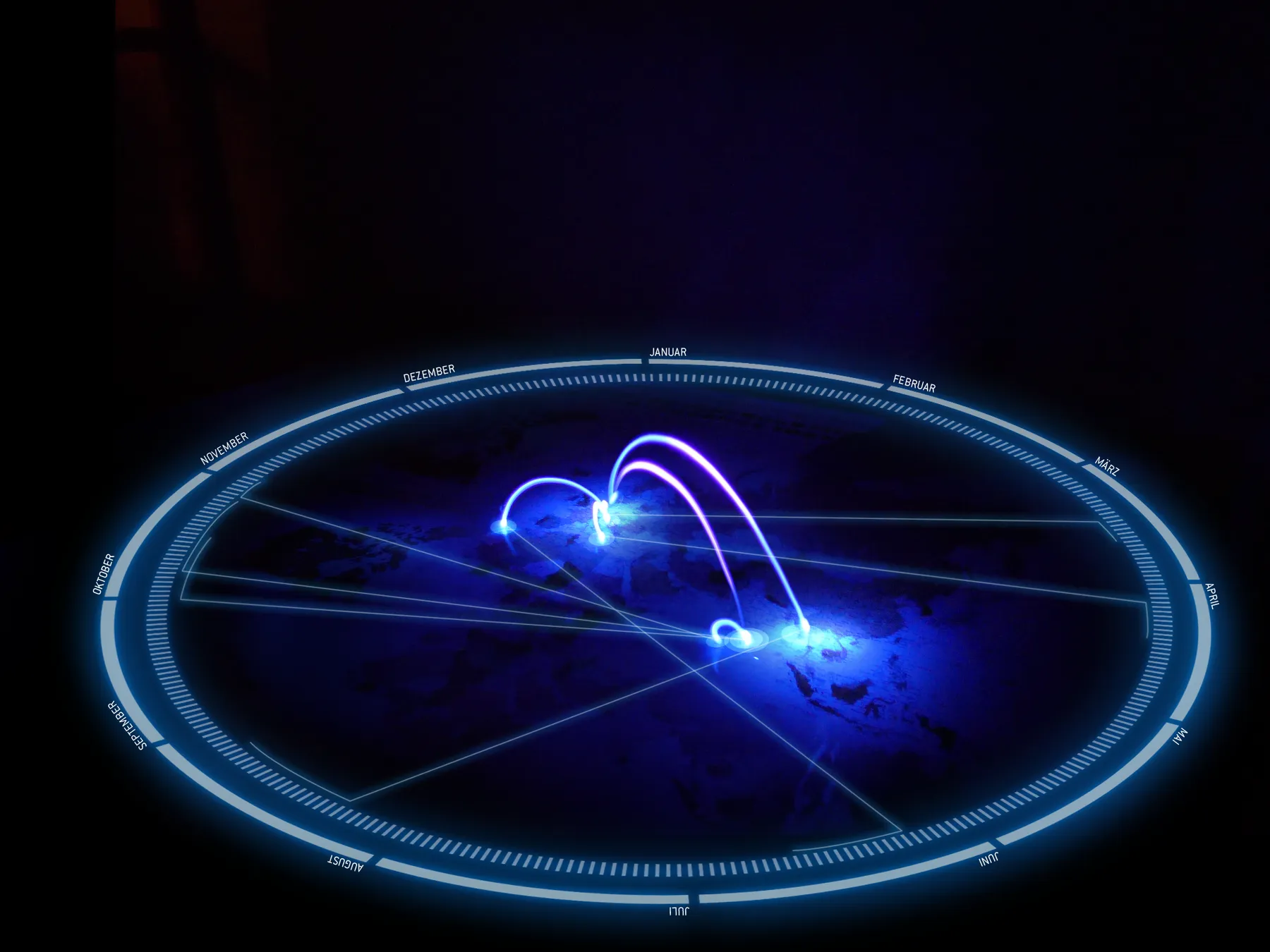 The calendar version of the composite: UV light arcs over the dark world map, enclosed by a glowing elliptical ring of months from January to December, with thin lines linking the destinations to months